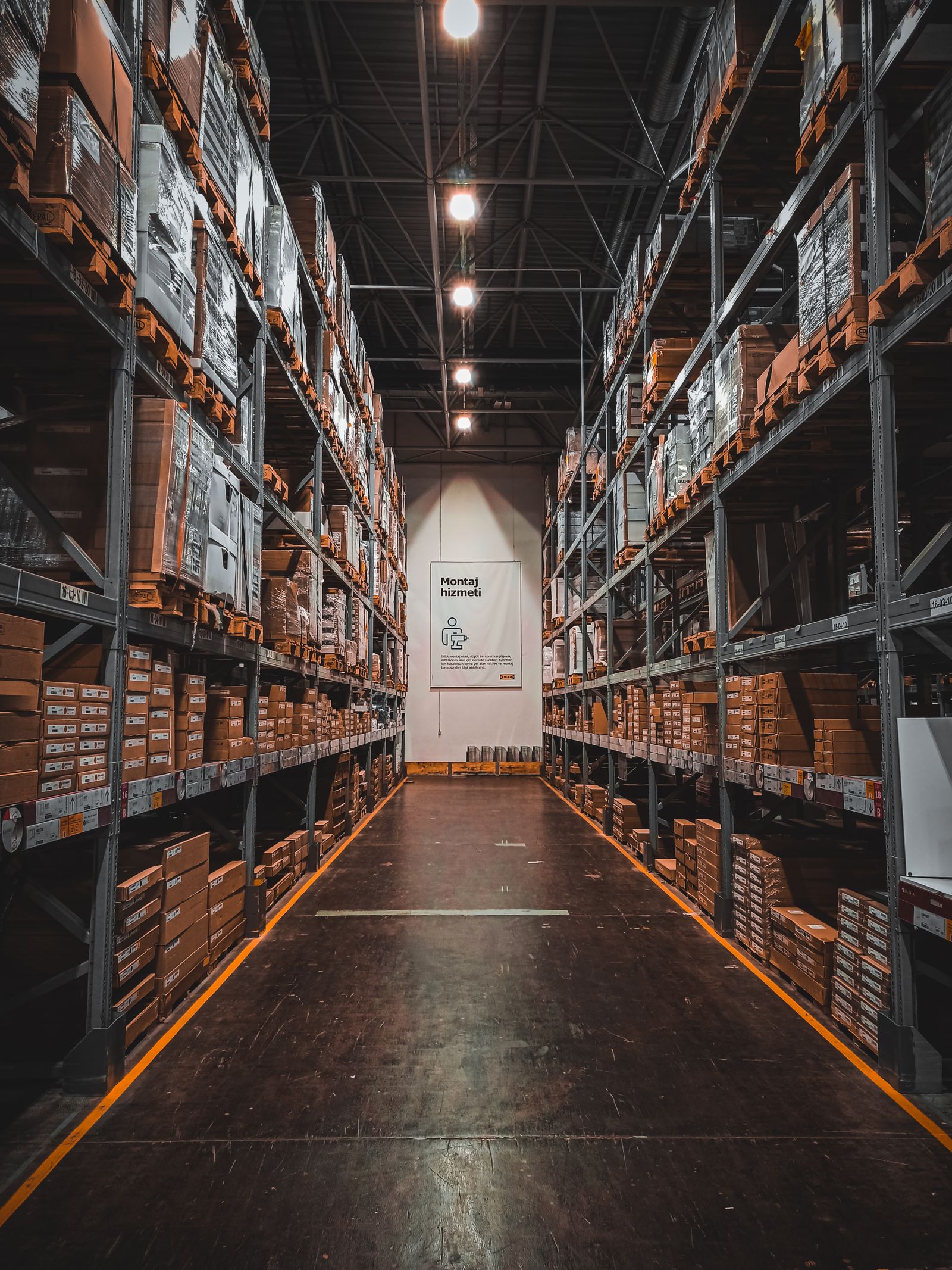 Warehouse aisle with stacked pallet racking